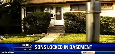 Photo of the Lands' home in Maryland from news broadcast saying, "Sons Locked in Basement."