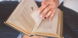 A woman thumbing through a book