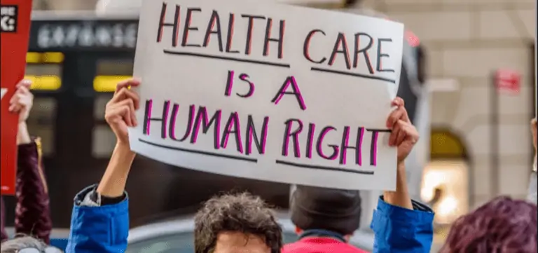 sign saying health care is a human right