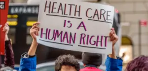 sign saying health care is a human right