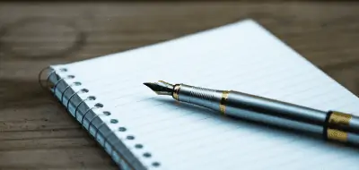 a pen on a notebook